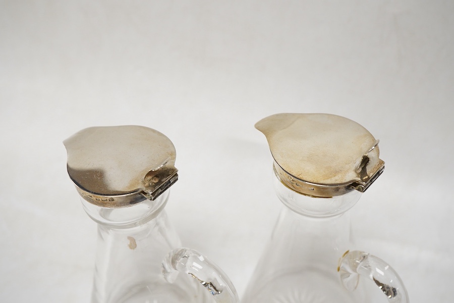 A pair of George V silver mounted glass whisky noggins, by S. Blanckensee & Sons Ltd, Birmingham, 1916, height 11cm.